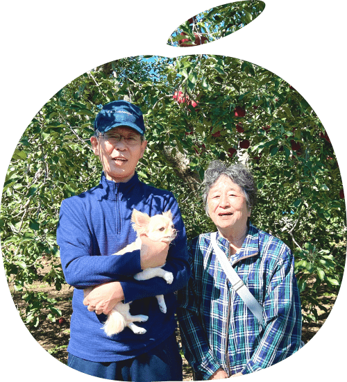 夫婦と犬が並んでいる